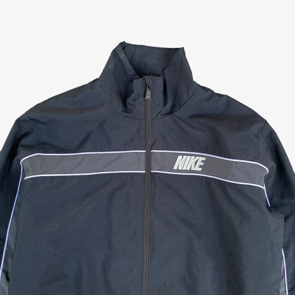 Vintage Nike Trainingsjacke Spellout "S-M" in schwarz | Vintage Online Shop www.unique-resale.com
