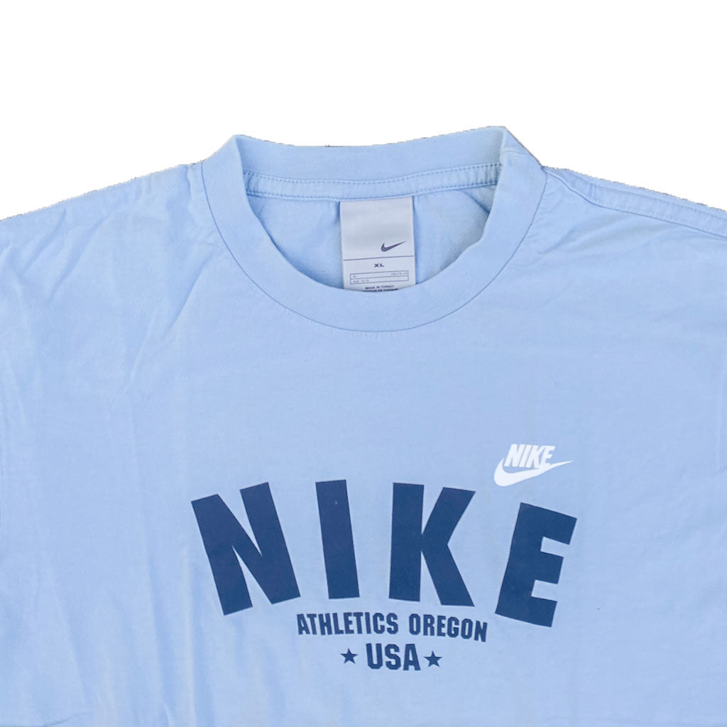 Vintage Nike T-Shirt 00s M-L in hellblau | Vintage Online Shop www.unique-resale.com