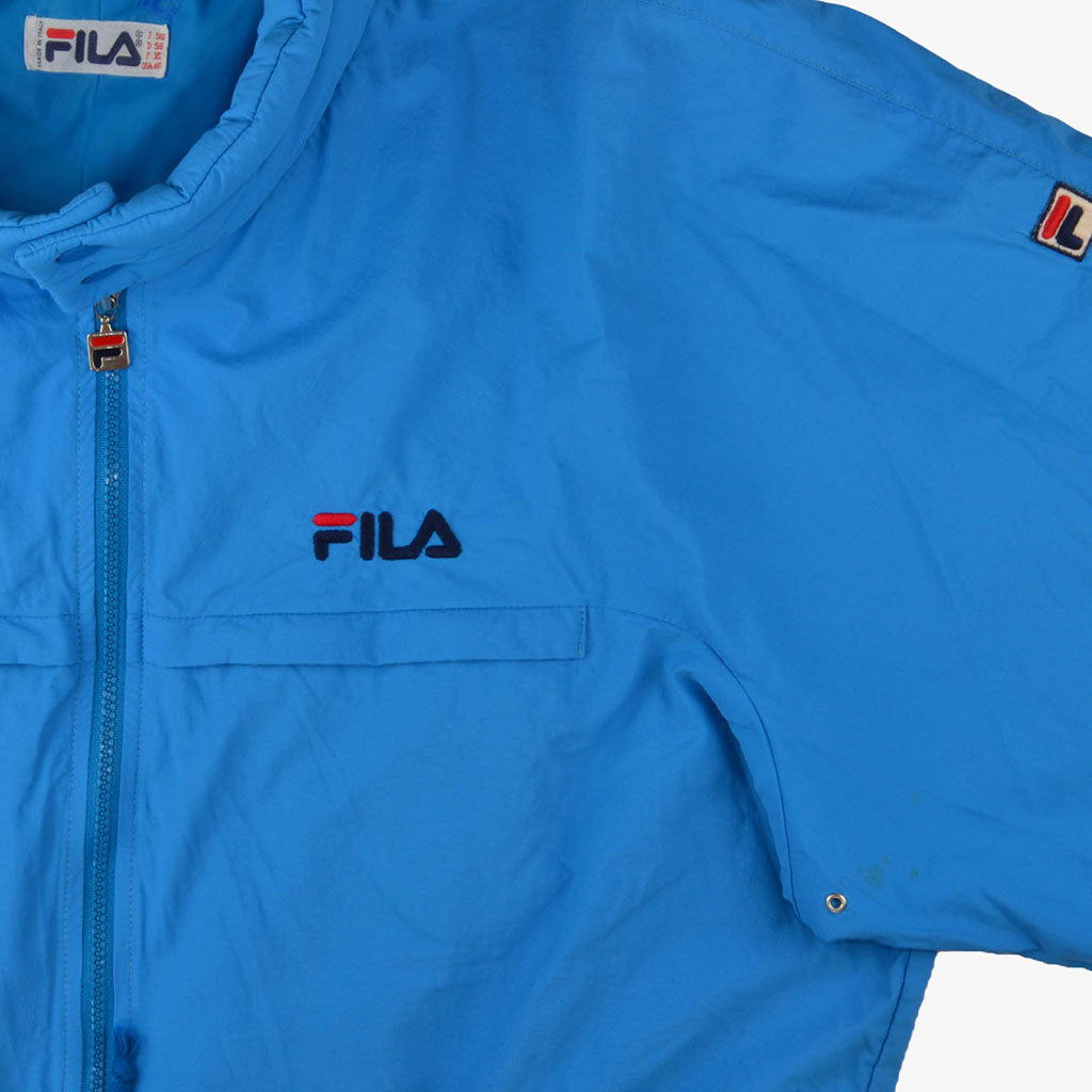  Vintage FILA Jumpsuit XL in blau vorne Logo und Armlogo | Vintage Online Shop Unique-Resale