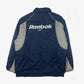 Vintage Reebok Jacke M Big Logo in dunkelblau hinten | Vintage Online Shop Unique-Resale
